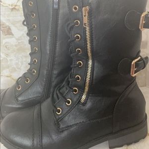 Super trendy Combat style boots with two decorative mock zipper accents.